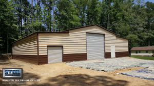 A large steel garage building with two garage doors.