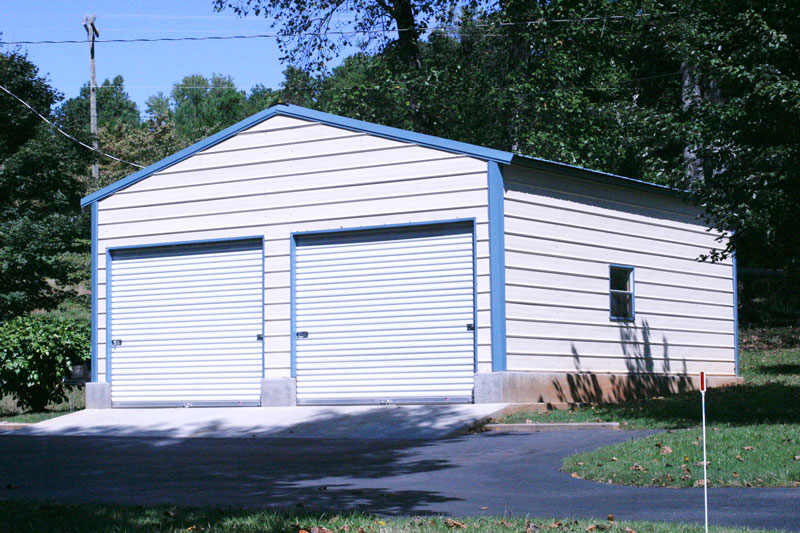 Blue trimmed 2 car steel garage with windows