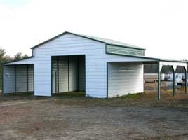 Ridgeline metal barn with two open lean to's with bay