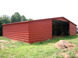 Valley style metal barn with two fully enclosed lean to's