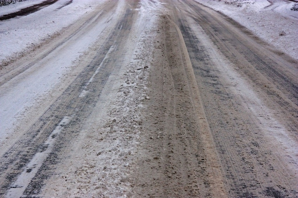 Icy roads with snow and road salt everywhere