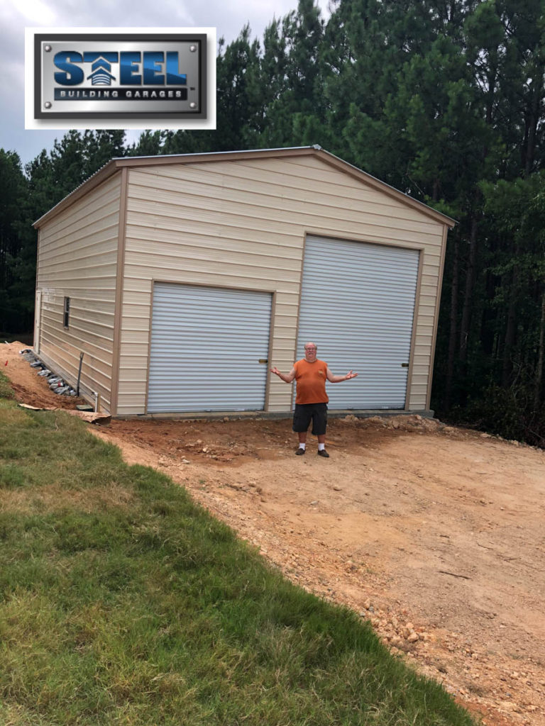 The finished garage with two different garage door sizes.