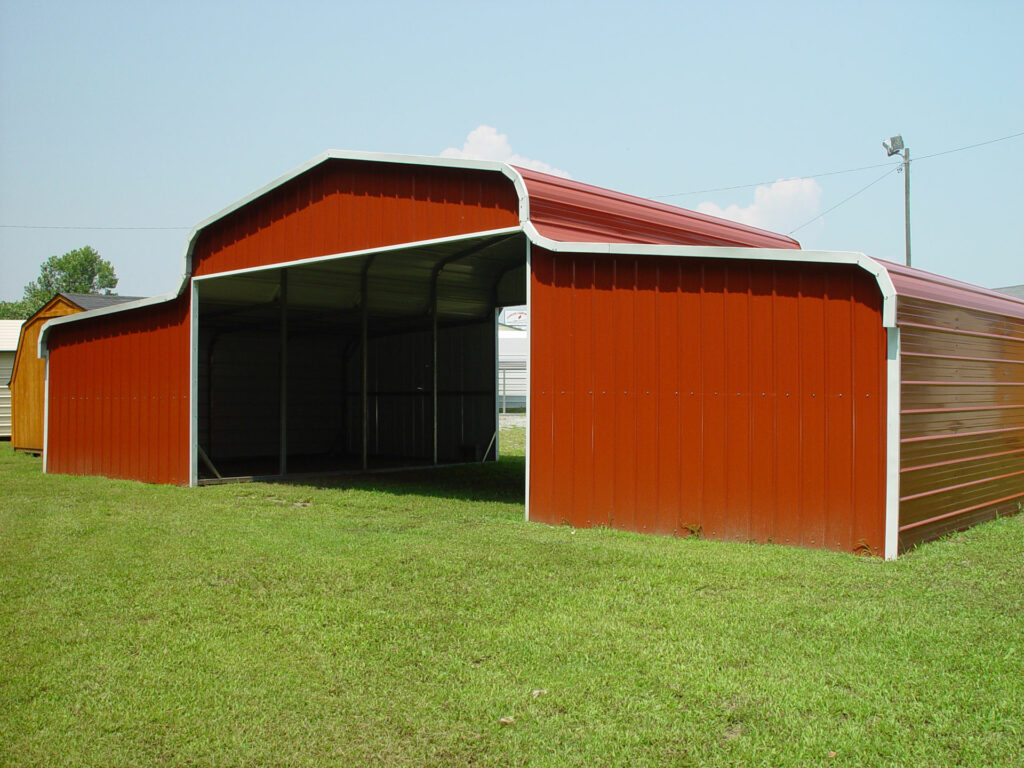 County Barn Style garage building. Red alls and roofing with white metal trim.